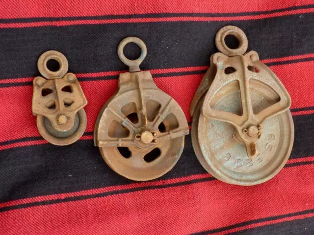 Lot of three  heavy iron cast vintage barn  primitive Industrial Pulleys wheels
