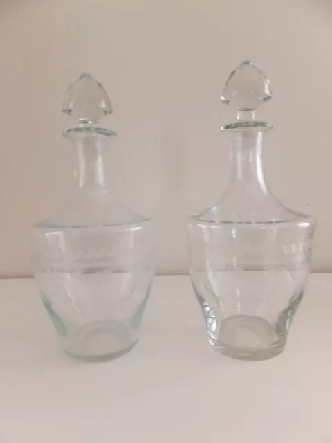 Pair of vintage elegant glass etched sherry decanters in very good condition