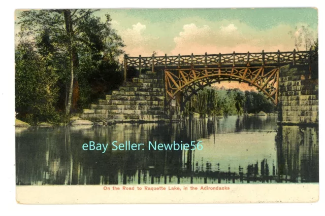 Raquette Lake NY - BRIDGE ON ROAD TO VILLAGE - Postcard Adirondacks