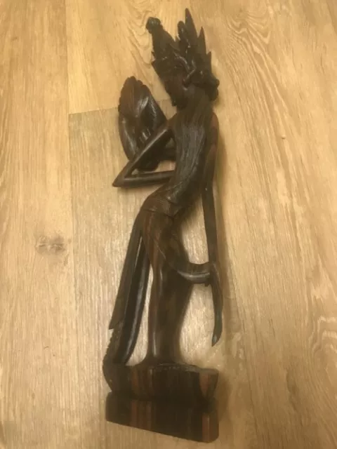 hand crafted and carved wood bali figure