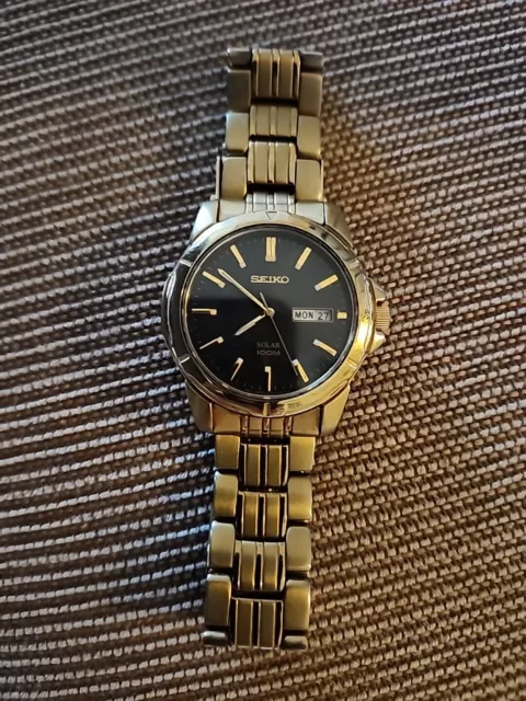 Seiko Men's Solar 100M Black Dial  Stainless Steel Date/Day Watch.Works