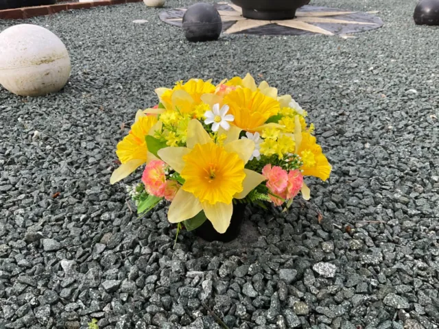 Beautiful artificial yellow daffodil and mini carnation grave pot