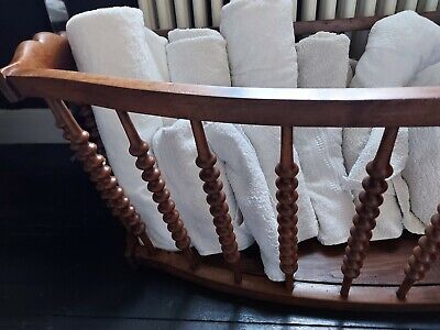 Antique crib/cot being used as a storage basket 3
