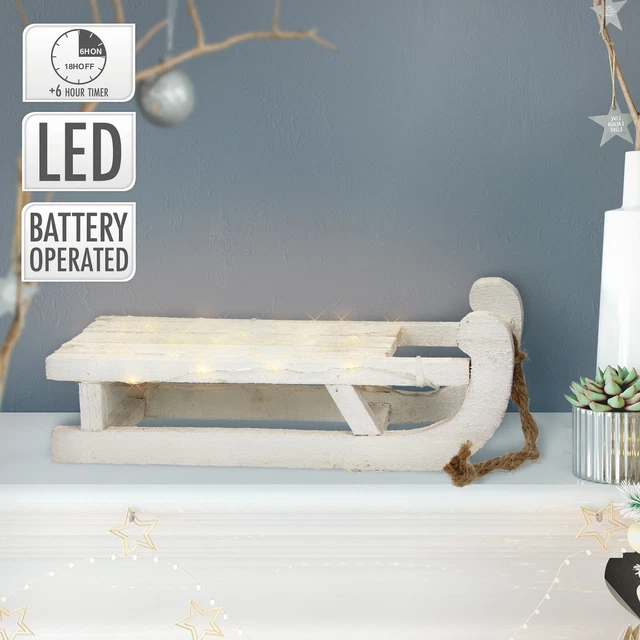 Slitta decorativa natalizia miniatura in legno bianco con 25 luci LED 31,5 cm