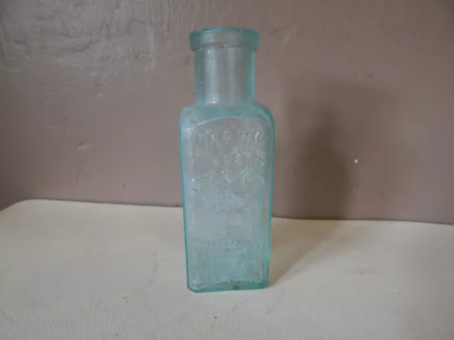 Antique FRANK MILLER'S CROWN DRESSING Aqua Colored 5" Tall Glass Bottle