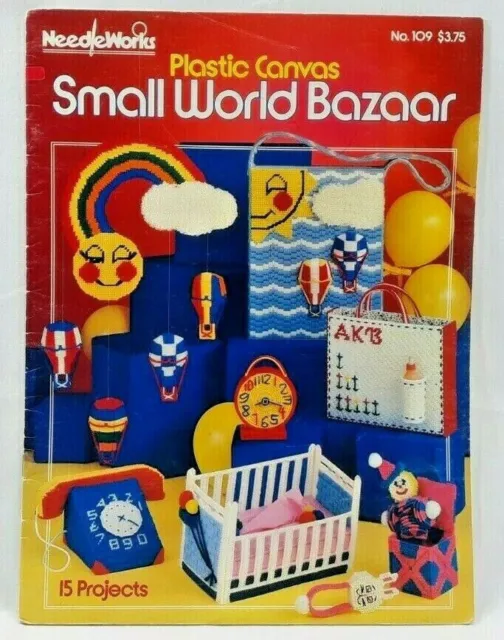 Libro de patrones de lona de plástico NeedleWorks Small World Bazaar 109 1982 vintage 6112