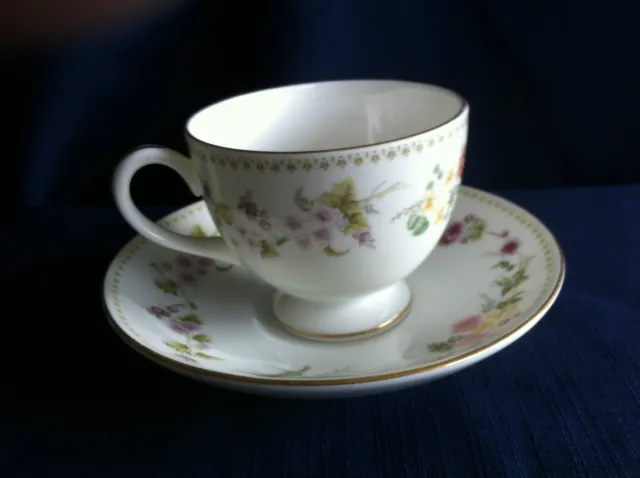 Wedgwood Mirabelle tea cup & saucer (some rim gilt wear)