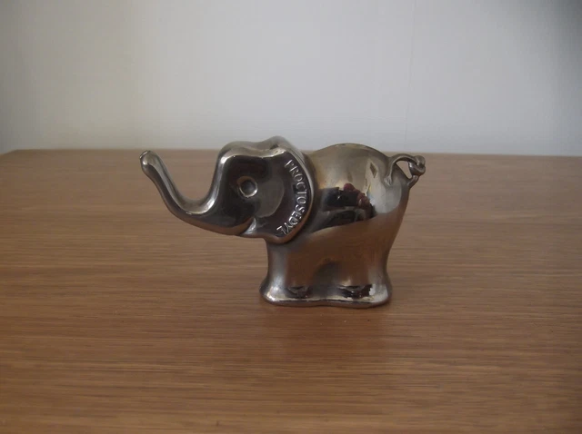 Vintage chrome plated elephant with brand name proctosedyl on his ear