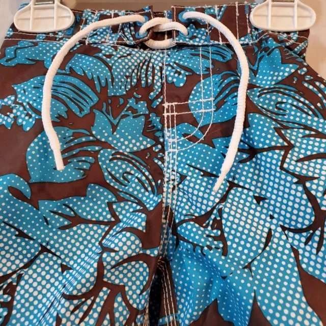 Blue, white and brown hibiscus swim trunks Size 6-9 months 2