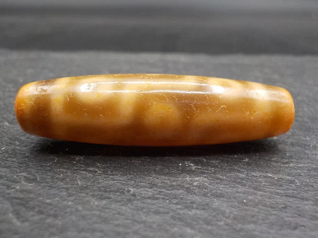 An Agate Dzi bead with a 9 Eye pattern from Tibet / Nepal.