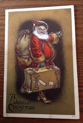 Antique A Joyful Christmas PostCard Santa St Nick With A Suitcase & Bag Embossed