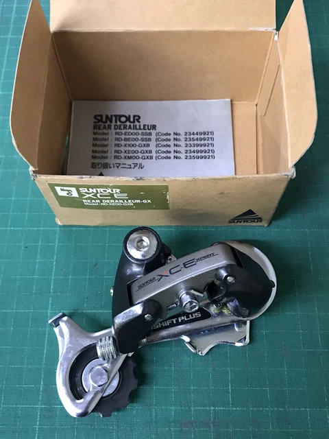 Dérailleur Arrière VTT Suntour XCExpert Accushift Plus - 7 Vitesses - Cage Longue - Japon