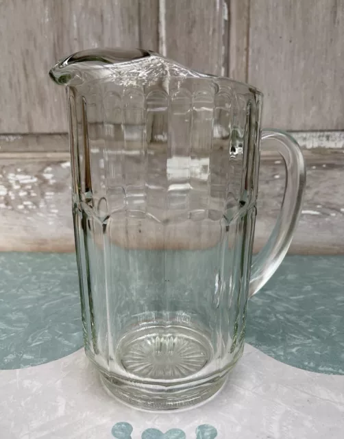 Vintage Heavy Paneled Clear Glass Water Pitcher with Ice Lip Starburst Base