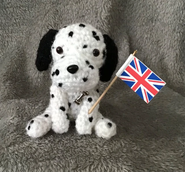 Dalmatian. Miniature Sitting Crochet Dog Waving Royal Flag