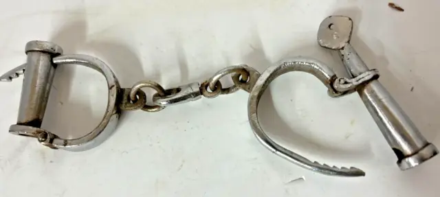 VINTAGE IRON HANDCUFFS THEY ARE NICKEL PLATED WITH WORKING KEY Ca 1910