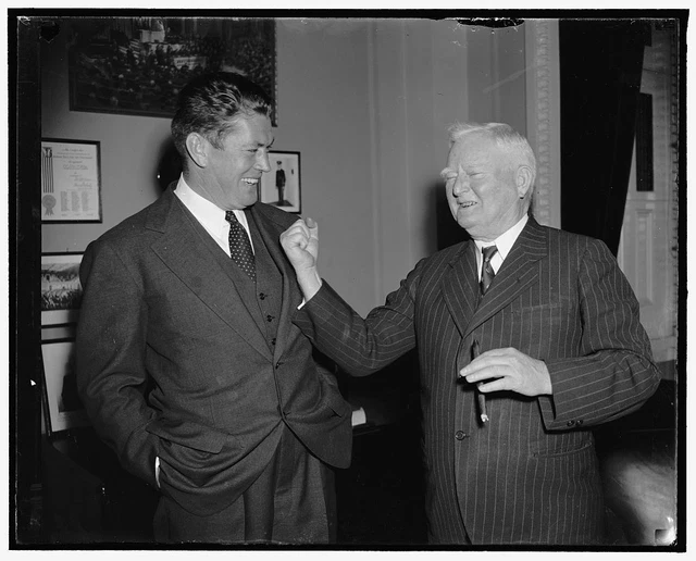 Reproduced 1938 Photo Vice President Displays "Right" To Former Champion Wash j