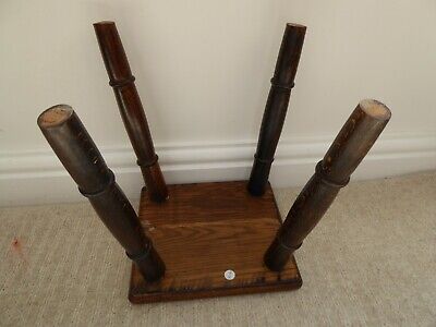 Vintage solid oak milking stool, 4 turned legs, carved edge to seat 6
