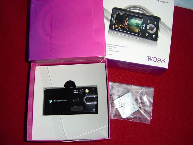 Vintage Sony Ericsson W995 mobile boxed +speakers etc (W.London)