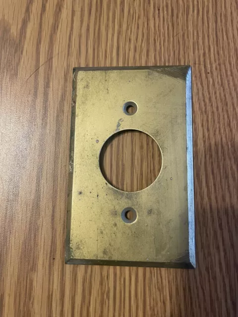 VINTAGE  BRASS ROUND HOLE OUTLET SWITCH COVER PLATE .  used