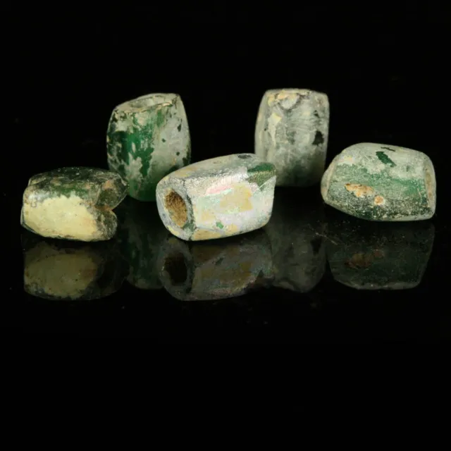 Ancient glass beads: FIVE genuine ancient Roman green glass beads, 2-3 century
