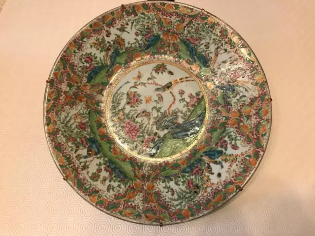 A huge Chinese canton famille rose, heavy gilt and windows plate, 19th C D40.5cm