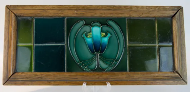 MINTONS TILE PANEL, glazed earthenware, with oak frame