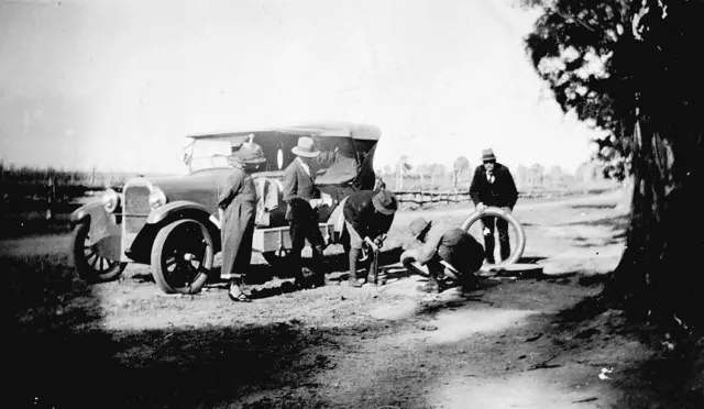 Gippsland, Victoria, 1925 A group of people beside a car watching as Old Photo