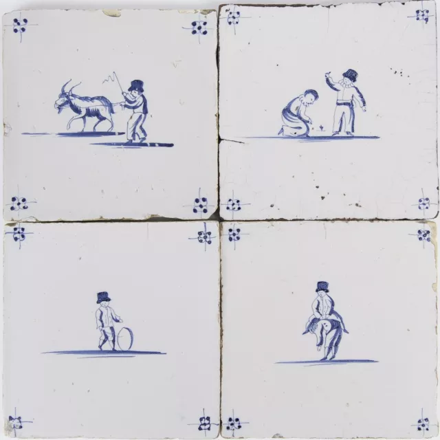 Nice set of 4 Dutch Delft Blue tiles, childplay, 18th century.