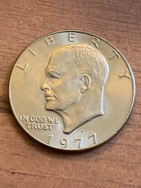 1977 D Eisenhower one dollar coin. Filled In Mint Mark Error (B52)