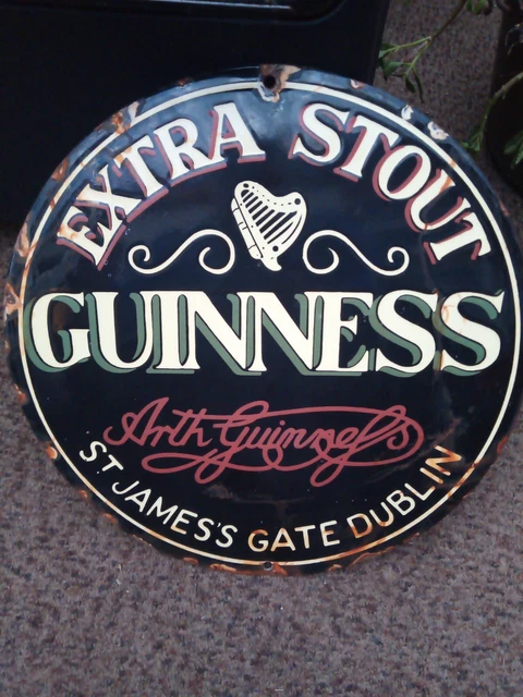 round enamel extra stout Guinness Dublin sign.