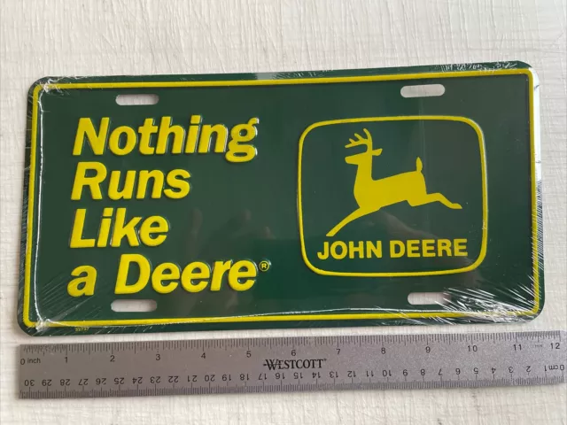 New In Plastic John Deere License Plate Tag “Nothing Runs Like A Deere”