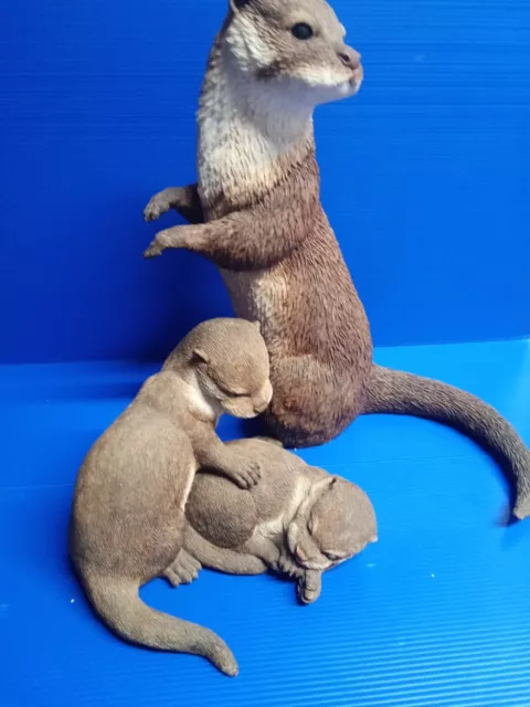 MOTHER OTTER AND CUBS (mother 14 inches high)