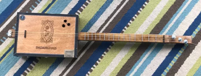 Guitarra eléctrica acústica estilo vintage caja de cigarros marca 3 cuerdas