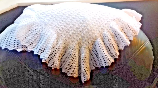 A hand crocheted White 3 ply baby Shawl