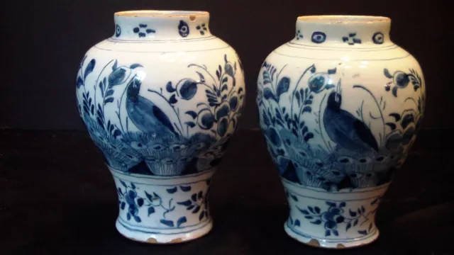 A Pair Of Dutch Delft Vases With Birds And Flowers