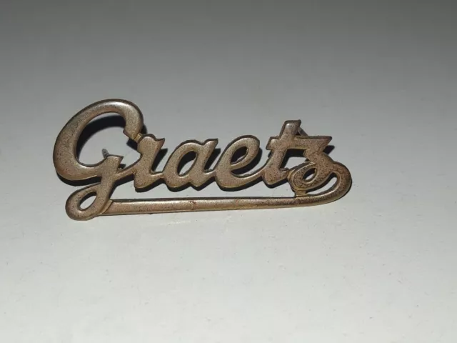 Emblem "Graetz" aus Graetz Melodia 4R UKW-Gross-Super - Röhrenradio