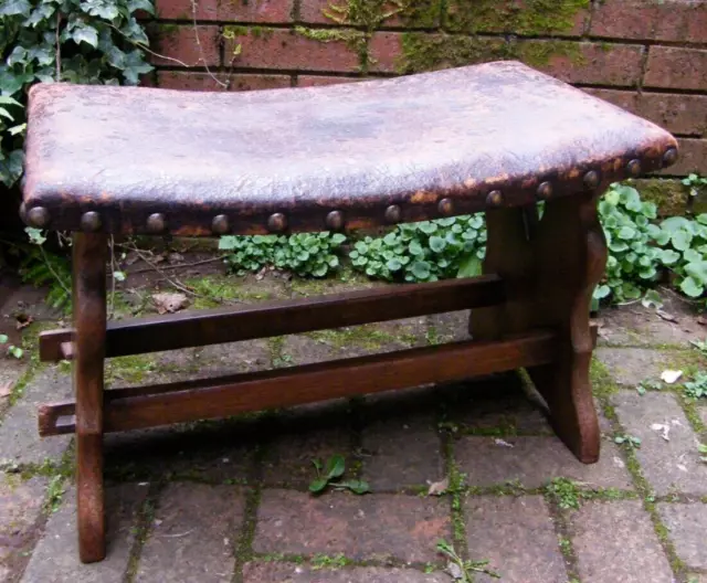 A LARGE ARTS & CRAFTS STOOL OAK WITH LEATHER TOP 62CM LONG 19th CENTURY