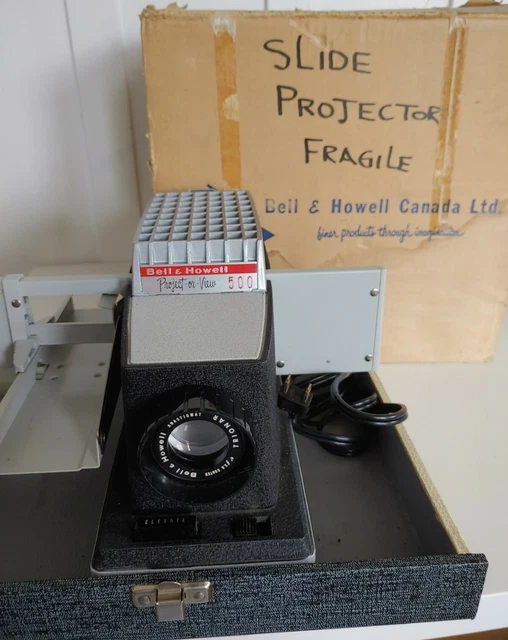 Proyector de extensión Bell & Howell de la década de 1960 500 modelo 710 con caja original y recibo LEER
