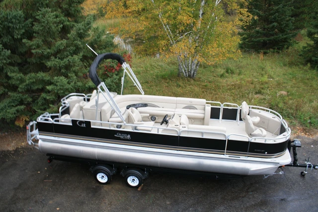 New 24  two tube pontoon boat with a new 115 hp and trailer
