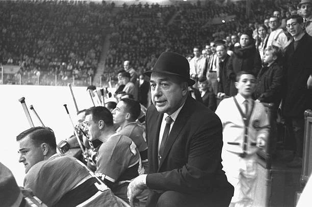 MONTREAL CANADIENS COACH Hector Toe Blake on bench with team durin