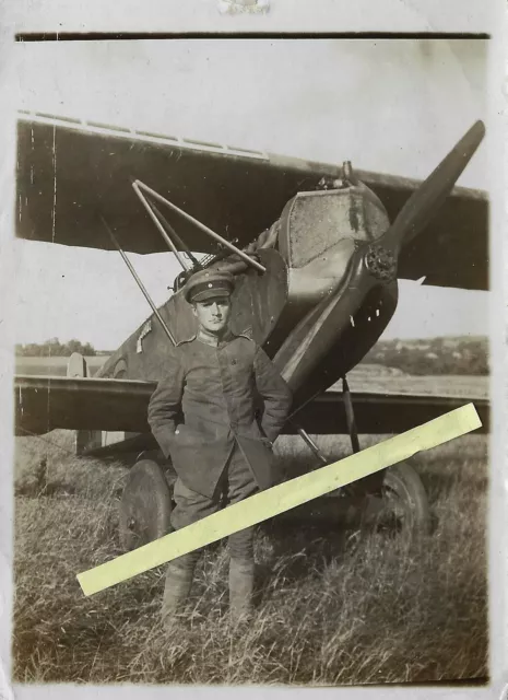WW1 plane in front of plane with squadron badge - naval aviator wangerooge?