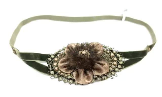 Velvet Headband  By Michal Negrin with A brown and green flower