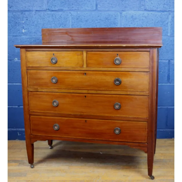 A Victorian Inlaid Mahogany Two over Three Chest of Drawers Tapering Supports