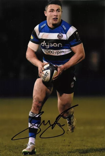 sam burgess runs with the ball for bath during the match signed 12x8 photo