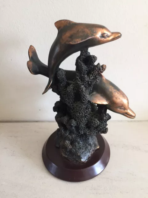 Resin Dolphin Ornament. With 2,dolphins. On Sea Weed. Wooden Base.7 Ins Tall.