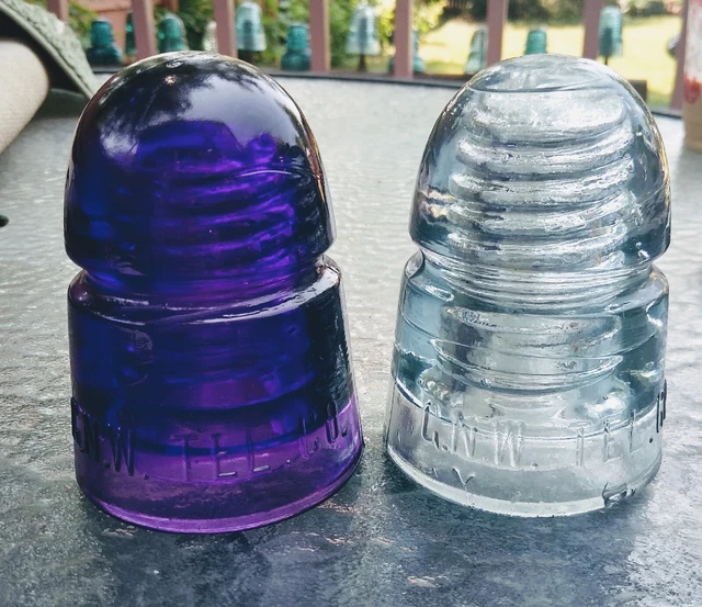 2 C.N.W. TEL CO. Glass insulators Royal Purple And Steel Blue