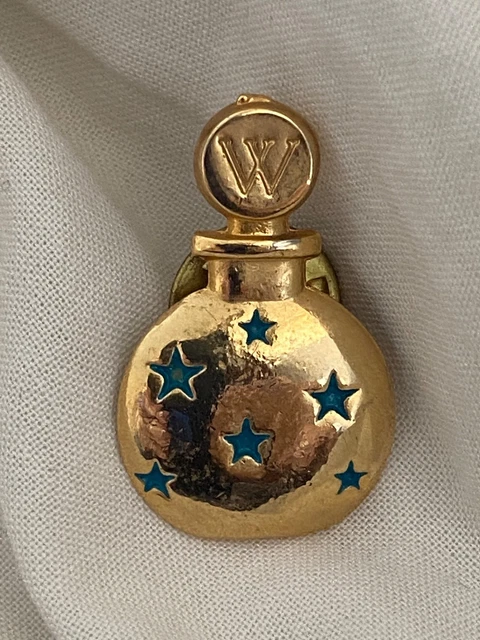 Broche métal argenté et céramique - Un grand marché