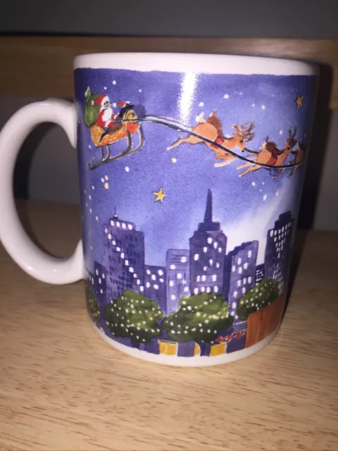 Santa’s Night Out Santas Little Helpers Cats On A Fence Mug by Gerrica Connolly