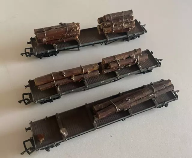 3X Oo Gauge Mixed Flat Wagons With Log Loads ( Some Loads Loose )