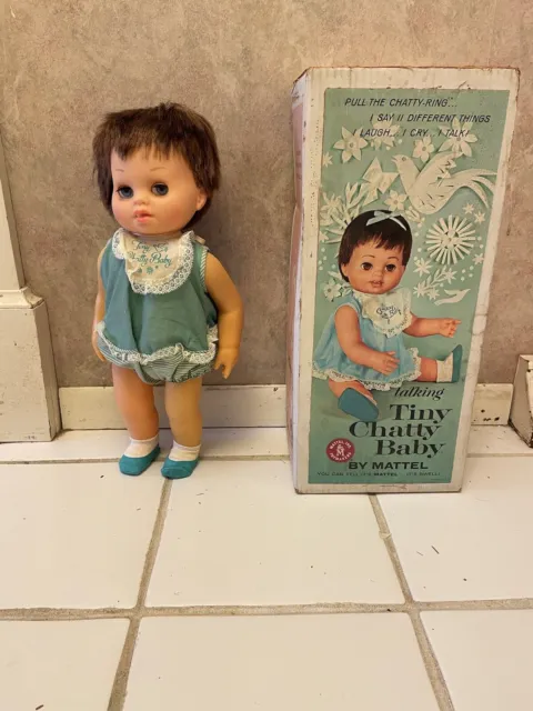 Vintage Tiny Chatty Baby Doll 15" high with brown hair and blue eyes, by Mattel